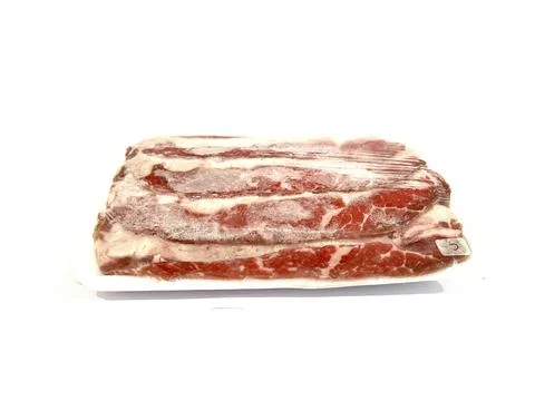 Pack of beef slice isolated on white background Stock Photos