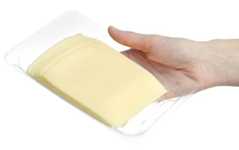 A pack of cheese slices in hands Stock Photos
