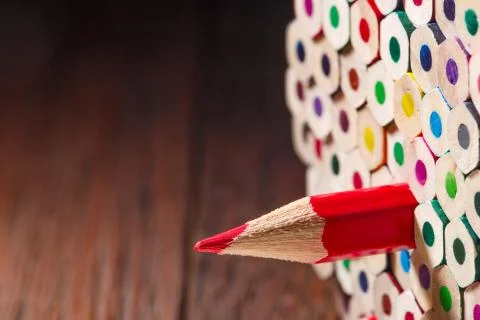 Pack of color pencils with a single sharp one symbolizing leadership concept 스톡 사진