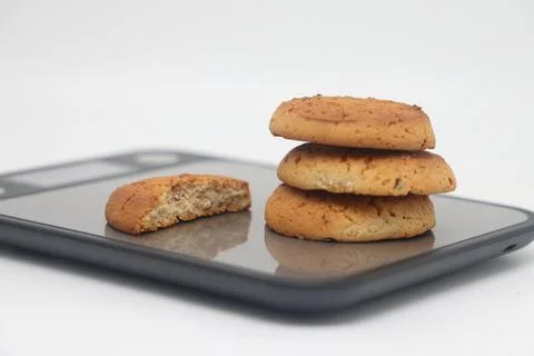 A pack of cookies on an electronic kitchen scale, accurate calorie counting,  Stock Photos