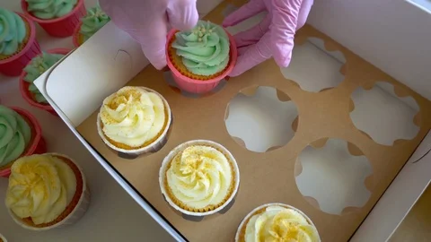 Pack cupcakes in a box Stock Footage 96297074