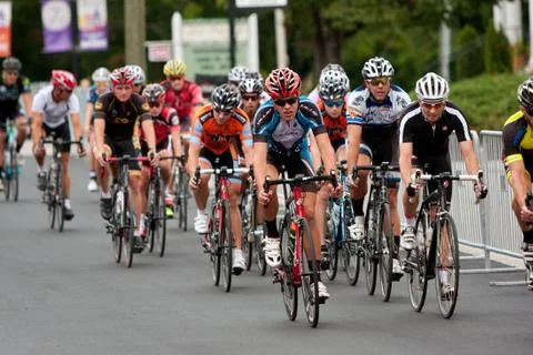 Pack of cyclists compete in duluth criterium event Stock Photos