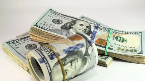 A pack of dollar bills rolling on the table. Stock Footage 77339763