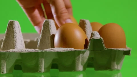 Pack eggs in a box. Ecologically dirty food. Stock Footage 204163093