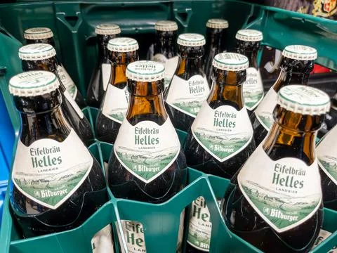 Pack of Eifelbrau Helles Beer Bottles in a Green Crate Stock Photos
