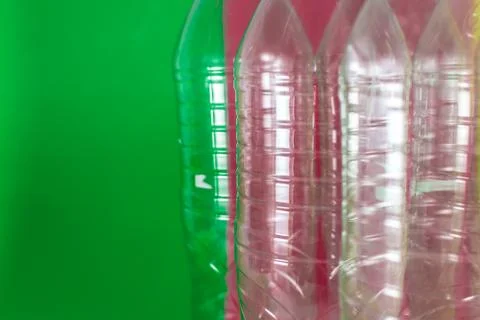 A pack of empty and recyclable plastic water bottles,  on a colored vibrant g Stock Photos