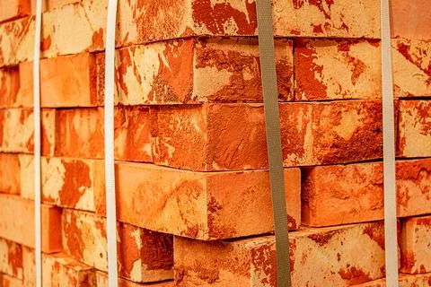 A pack of fireclay bricks in a construction warehouse on the street. The conc Stock Photos