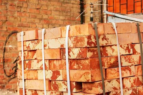 A pack of fireclay bricks in a construction warehouse on the street. The conc Stock Photos