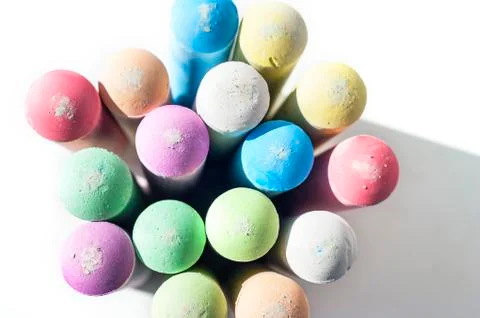 Pack of Jumbo Sidewalk Chalk, Assorted Colors, Bold Tips Casting Shadow on Wh Stock Photos