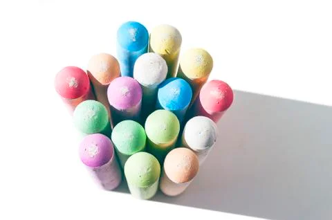 Pack of Jumbo Sidewalk Chalk, Assorted Colors, Bold Tips Casting Shadow Stock Photos