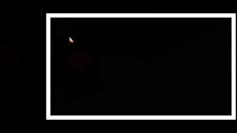 Pack of Man lights a match in darkness. Slow Motion Stock Footage 73540148