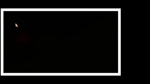 Pack of Man lights a match in darkness. Slow Motion Stock Footage 73540487