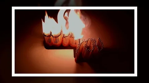 Pack of Man lights a match in darkness. Slow Motion Stock Footage 73541972