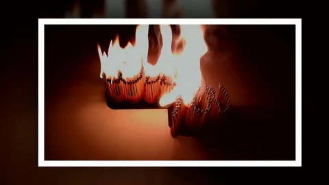 Pack of Man lights a match in darkness. Slow Motion Stock Footage 73544083