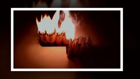 Pack of Man lights a match in darkness. Slow Motion Stock Footage 73544659