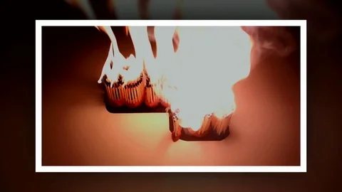 Pack of Man lights a match in darkness. Slow Motion Stock Footage 73545055