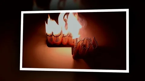 Pack of Man lights a match in darkness. Slow Motion Stock Footage 73545602