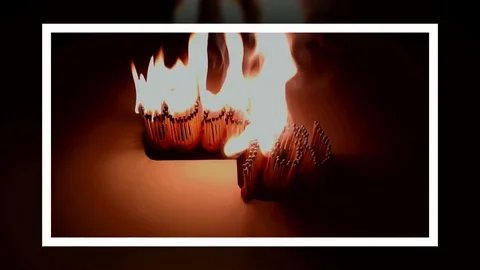 Pack of Man lights a match in darkness. Slow Motion Stock Footage 73547241