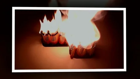 Pack of Man lights a match in darkness. Slow Motion Stock Footage 73547887