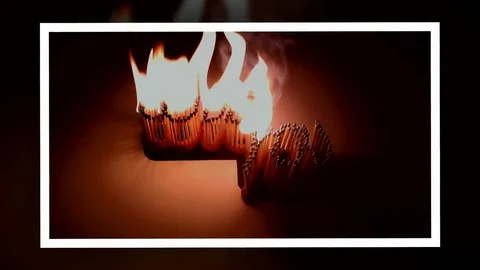 Pack of Man lights a match in darkness. Slow Motion Stock Footage 73548439