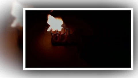 Pack of Man lights a match in darkness. Slow Motion Stock Footage 73552252