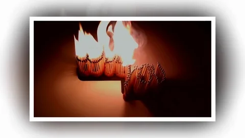 Pack of Man lights a match in darkness. Slow Motion Stock Footage 73553051