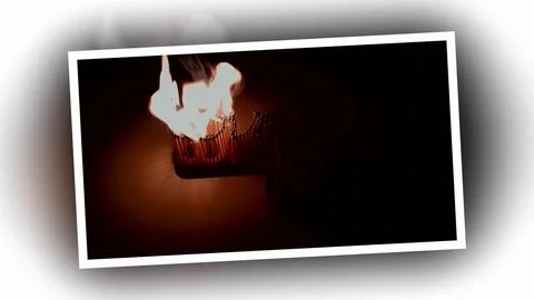 Pack of Man lights a match in darkness. Slow Motion Stock Footage 73554658