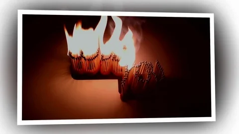 Pack of Man lights a match in darkness. Slow Motion Stock Footage 73555248