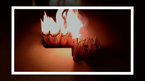 Pack of Man lights a match in darkness. Slow Motion Stock Footage 73555609