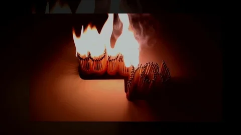 Pack of Man lights a match in darkness. Slow Motion Stock Footage 73556024
