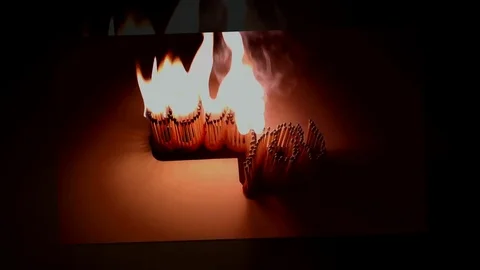 Pack of Man lights a match in darkness. Slow Motion Stock Footage 73560562