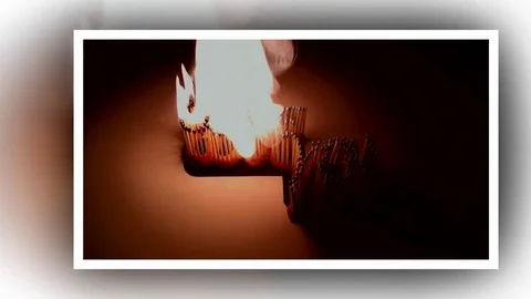 Pack of Man lights a match in darkness. Slow Motion Stock Footage 73561099