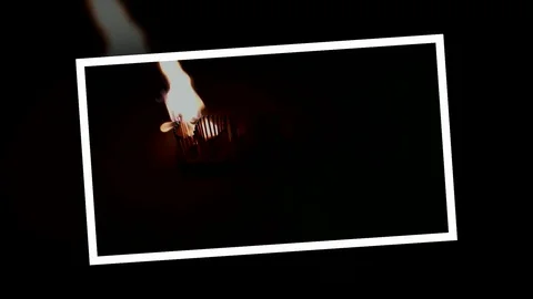 Pack of Man lights a match in darkness. Slow Motion Stock Footage 73564917