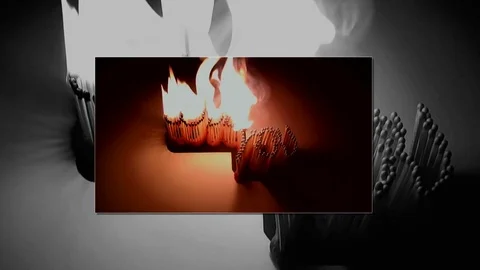 Pack of Man lights a match in darkness. Slow Motion Stock Footage 73566146