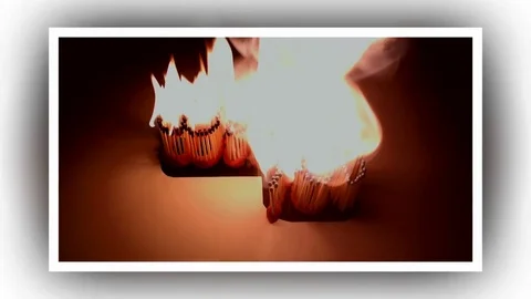 Pack of Man lights a match in darkness. Slow Motion Stock Footage 73583658