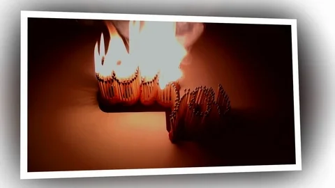 Pack of Man lights a match in darkness. Slow Motion Stock Footage 73584057