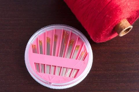 Pack of needles and a skein of thread Stock Photos