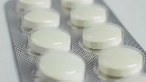 Pack of pills isolated on white background, macro closeup rotation 库存影片 53790100