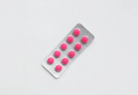 Pack of Pills pink on the table. Close up of Ibuprofen medicine in a blister  Stock Photos
