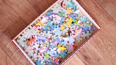 Pack with puzzle game on floor 動画素材 95318977