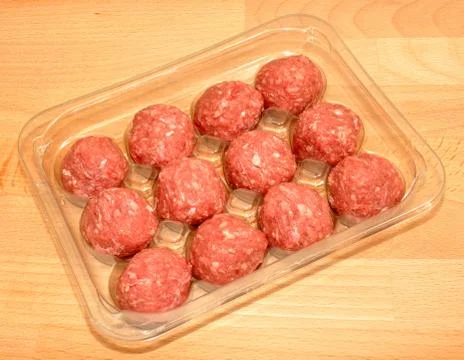 Pack of raw meatballs Stock Photos