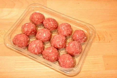 Pack of raw meatballs Stock Photos