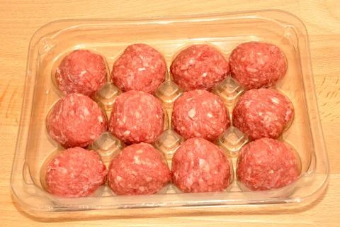 Pack of raw meatballs Stock Photos