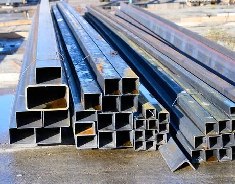 A pack of rectangular metal pipe outdoors Stock Photos