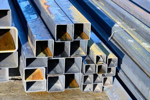 A pack of rectangular metal pipe outdoors Stock Photos