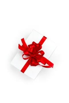 Pack with red bow on white background Фото