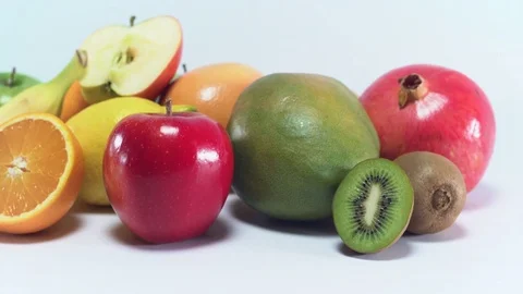 Pack-shot of different fruit on white background, panning Video stock 75817692