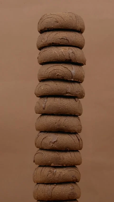 A pack, stack of chocolate gingerbread cookies or cookies rotate on a brown Stock Footage 274503953