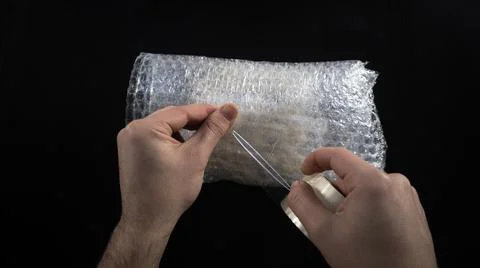 Packacing with bubble wrap and duct tape Stock-Fotos
