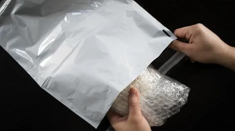 Packacing wrapped product with bubble wrap Stock-Fotos